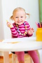 Toddler girl drawing with pencils Royalty Free Stock Photo