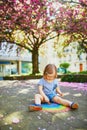 Toddler girl drawing rainbow with colorful chalks Royalty Free Stock Photo