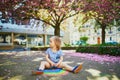 Toddler girl drawing rainbow with colorful chalks Royalty Free Stock Photo