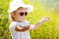 Toddler girl enjoying summer light