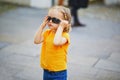 Toddler girl having fun on a street of medieval town of Quimper, Brittany, France. Happy child outdoors Royalty Free Stock Photo