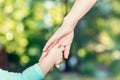 Toddler girl holding hands with her mother Royalty Free Stock Photo