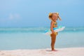 Toddler girl with Inflatable circle on beach