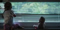 Toddler girl looking out the window Royalty Free Stock Photo