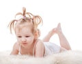 Toddler girl lying in bed Royalty Free Stock Photo