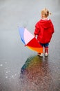 Toddler girl outdoors at rainy day Royalty Free Stock Photo