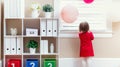 Toddler girl peeking out the window Royalty Free Stock Photo