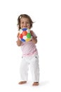 Toddler girl playing with a colored ball Royalty Free Stock Photo