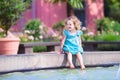 Toddler girl playing in a fountain Royalty Free Stock Photo