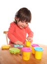 Toddler girl playing with play doh Royalty Free Stock Photo