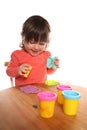 Toddler girl playing with play doh Royalty Free Stock Photo