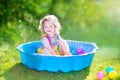 Toddler girl playing wil balls in the garden Royalty Free Stock Photo