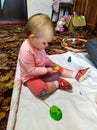 Toddler girl sculpt with plasticine at home