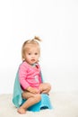 toddler girl sitting on pottie
