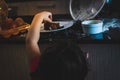 Toddler girl sneaking around grabbing chocolate cake Royalty Free Stock Photo