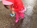 Toddler girl with umbrella outdoors at rainy day Royalty Free Stock Photo