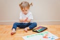 Toddler girl and watercolors. Early learning, art.