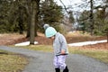 Toddler Girl on woodsy path looking down Royalty Free Stock Photo