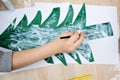 Toddler hand painting glue on paper christmas tree Royalty Free Stock Photo