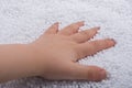 Toddler hand in White polystyrene foam balls