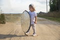 a toddler holds a reflector for the photographer. little helper assistant Royalty Free Stock Photo