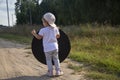 A toddler holds a reflector for the photographer. little helper assistant Royalty Free Stock Photo