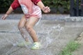 Toddler jumping in pool of water at the summer or autumn day Royalty Free Stock Photo