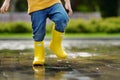 Toddler jumping in pool of water at the summer or autumn day Royalty Free Stock Photo