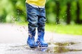 Toddler jumping in pool of water at the summer or autumn day Royalty Free Stock Photo