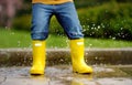 Toddler jumping in pool of water at the summer or autumn day Royalty Free Stock Photo