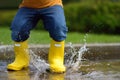 Toddler jumping in pool of water at the summer or autumn day Royalty Free Stock Photo