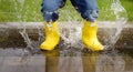 Toddler jumping in pool of water at the summer or autumn day Royalty Free Stock Photo