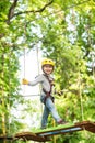 Toddler kindergarten. Active children. Balance beam and rope bridges. Toddler age. Cute child boy. Rope park - climbing Royalty Free Stock Photo