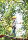 Toddler kindergarten. Active children. Balance beam and rope bridges. Toddler age. Cute child boy. Rope park - climbing Royalty Free Stock Photo