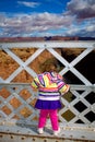 Toddler Looking Over the Edge of a Bridge Royalty Free Stock Photo