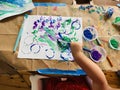 Toddler Painting at the Kitchen Table Royalty Free Stock Photo