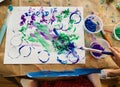 Toddler Painting at the Kitchen Table Royalty Free Stock Photo