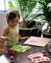 Toddler painting on the recycled cardboard at home