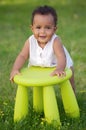 Toddler playing with chair Royalty Free Stock Photo