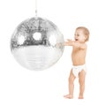 Toddler playing with disco ball Royalty Free Stock Photo