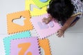 A toddler playing with number puzzles Royalty Free Stock Photo