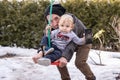 Toddler playing outdoor with dad on a swing Royalty Free Stock Photo