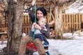 Toddler playing outdoor with dad on a swing Royalty Free Stock Photo