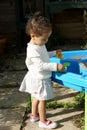 Toddler playing with sand