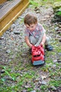 Toddler Playing with a Toy Fire Truck Outside - Series 4 Royalty Free Stock Photo