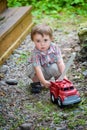 Toddler Playing with a Toy Fire Truck Outside - Series 2 Royalty Free Stock Photo