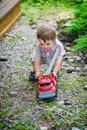 Toddler Playing with a Toy Fire Truck Outside - Series 3 Royalty Free Stock Photo