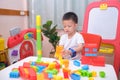 Toddler playing with toys, Cute Asian 5 years old toddler boy playing with colorful plastic building blocks indoor at home