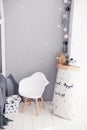 Toddler room with white cradle, chair and storage bag Royalty Free Stock Photo