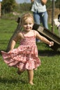 Toddler running outdoors Royalty Free Stock Photo